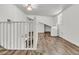 Finished attic area with hardwood floors, white walls, natural light, and staircase access at 105 Evatt Dr, Goose Creek, SC 29445