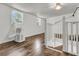 Spacious attic area with hardwood floors, white walls, natural light, and staircase access at 105 Evatt Dr, Goose Creek, SC 29445