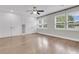 Bright bedroom featuring hardwood floors, large windows, and white closet at 105 Evatt Dr, Goose Creek, SC 29445