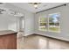 Bedroom featuring laminate flooring, large windows, and mirrored closet doors at 105 Evatt Dr, Goose Creek, SC 29445