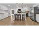 Spacious kitchen with white cabinets, a center island with seating, and stainless steel appliances at 105 Evatt Dr, Goose Creek, SC 29445