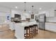 Modern kitchen features a center island with seating, stainless steel appliances, and brick backsplash at 105 Evatt Dr, Goose Creek, SC 29445
