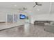 Bright living room with vaulted ceilings, wood-look tiled flooring, and a large sofa at 105 Evatt Dr, Goose Creek, SC 29445