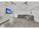 Bright living room featuring vaulted ceilings, wood-look tiled flooring, and a large sofa at 105 Evatt Dr, Goose Creek, SC 29445