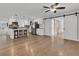 Open-concept living space with a kitchen, hardwood floors, and sliding barn doors to other spaces at 105 Evatt Dr, Goose Creek, SC 29445