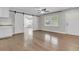 Bright living room featuring hardwood floors, sliding barn doors, and large window at 105 Evatt Dr, Goose Creek, SC 29445