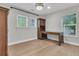 Bright room with light-colored walls, hardwood floors, and a built-in wooden desk and cabinet at 105 Evatt Dr, Goose Creek, SC 29445