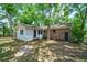 View of backyard, surrounded by mature trees, blending nature with architectural design at 106 Kent Cir, Ladson, SC 29456