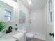 Modern bathroom featuring a glass-enclosed shower with white tile, sleek fixtures, and neutral finishes at 106 Kent Cir, Ladson, SC 29456