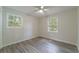 Neutral colored bedroom with windows and light colored floors at 106 Kent Cir, Ladson, SC 29456
