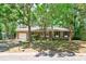 Traditional brick home with a single car garage, mature trees and a well-kept lawn at 106 Kent Cir, Ladson, SC 29456