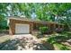 A single-story brick home with an attached garage and a well-maintained lawn at 106 Kent Cir, Ladson, SC 29456