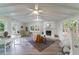 Bright living room with vaulted ceilings, fireplace, and a cozy seating area by the windows at 106 Kent Cir, Ladson, SC 29456