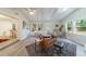 Bright living room showing seating and flow into the kitchen and outdoor space at 106 Kent Cir, Ladson, SC 29456