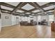 A finished basement with exposed ceiling beams, fireplace, and living area for relaxing at 108 Mourning Dove Dr, Bonneau, SC 29431