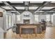 Finished basement with exposed beams, fireplace, and comfortable seating at 108 Mourning Dove Dr, Bonneau, SC 29431