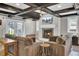 A finished basement with exposed beams, fireplace, and cozy seating area at 108 Mourning Dove Dr, Bonneau, SC 29431