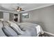 Comfortable bedroom with ceiling fan and wall mounted television with open doorway into the home at 108 Mourning Dove Dr, Bonneau, SC 29431