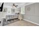 Nautical themed bedroom with a ceiling fan and two windows and a queen sized bed at 108 Mourning Dove Dr, Bonneau, SC 29431