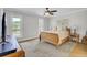 Bright bedroom with large windows, soft lighting, and carpet flooring creates a serene and inviting atmosphere at 108 Mourning Dove Dr, Bonneau, SC 29431