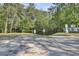 Outdoor boat ramp access point for easy water activities, surrounded by lush trees and clear signage at 108 Mourning Dove Dr, Bonneau, SC 29431