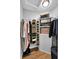 Organized walk-in closet with hanging rods, shelves, and storage for clothes and accessories at 108 Mourning Dove Dr, Bonneau, SC 29431