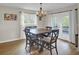 Dining room featuring a wooden table, seating for four, and a view of the backyard at 108 Mourning Dove Dr, Bonneau, SC 29431