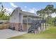 Two-story home with grey siding and a large backyard at 108 Mourning Dove Dr, Bonneau, SC 29431