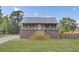 Charming home with a brick foundation, a metal roof, and a welcoming wooden staircase leading to the entrance at 108 Mourning Dove Dr, Bonneau, SC 29431