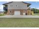 Spacious garage in a two-story home with a large yard at 108 Mourning Dove Dr, Bonneau, SC 29431