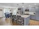 Open-concept kitchen and dining area with gray cabinets, and stainless steel appliances at 108 Mourning Dove Dr, Bonneau, SC 29431