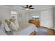 Comfortable bedroom features a ceiling fan, natural light, and private access to a bathroom, creating a relaxing retreat at 108 Mourning Dove Dr, Bonneau, SC 29431