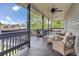 Relaxing covered porch with cozy seating and a view of the surrounding neighborhood at 108 Mourning Dove Dr, Bonneau, SC 29431