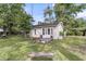 Exterior of a cottage house that includes a swing set in the backyard at 108 Williamsburg Ct, Goose Creek, SC 29445