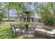 Backyard with a circular lounge area for outdoor relaxation and entertainment at 108 Williamsburg Ct, Goose Creek, SC 29445