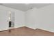 Clean basement with wood floors and a door leading to a stylish bathroom at 108 Williamsburg Ct, Goose Creek, SC 29445