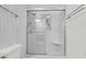 Modern bathroom with a glass-enclosed shower, textured wall, and a neutral color palette at 108 Williamsburg Ct, Goose Creek, SC 29445