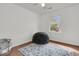 Sunlit bedroom featuring hardwood floors, a patterned rug, and modern accents at 108 Williamsburg Ct, Goose Creek, SC 29445