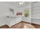 Bright bedroom features built-in cabinets, hardwood floors, and two windows letting in natural light at 108 Williamsburg Ct, Goose Creek, SC 29445