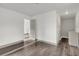Neutral bedroom with hardwood floors features an open door leading to another room at 108 Williamsburg Ct, Goose Creek, SC 29445