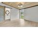 Bright bedroom with a view of the backyard, wood paneling, and an attached bathroom at 108 Williamsburg Ct, Goose Creek, SC 29445