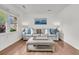 Inviting living room showcasing hardwood floors, natural light, and comfortable seating arrangement at 108 Williamsburg Ct, Goose Creek, SC 29445