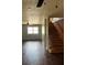 Wide shot of living room with laminate floors and staircase at 1110 Pickett St, Moncks Corner, SC 29461