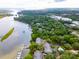 Aerial view of luxurious waterfront community with lush green trees and a private pool at 112 Waterfront Plantation Dr, Charleston, SC 29412