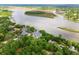 Aerial view of luxurious waterfront community surrounded by lush green trees near the marsh at 112 Waterfront Plantation Dr, Charleston, SC 29412