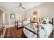 Comfortable bedroom featuring two twin beds with unique patterned quilts and a decorative area rug at 112 Waterfront Plantation Dr, Charleston, SC 29412
