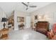 Neutral bedroom featuring a ceiling fan, furniture, and natural light from nearby doorway at 112 Waterfront Plantation Dr, Charleston, SC 29412