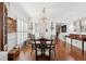 Elegant dining room with hardwood floors, a large chandelier, and traditional furniture at 112 Waterfront Plantation Dr, Charleston, SC 29412