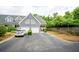 Charming townhome featuring a two-car garage, manicured landscaping, and inviting curb appeal at 112 Waterfront Plantation Dr, Charleston, SC 29412