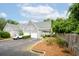 Beautiful townhome showcasing a two-car garage, lovely landscaping, and a well-maintained exterior at 112 Waterfront Plantation Dr, Charleston, SC 29412